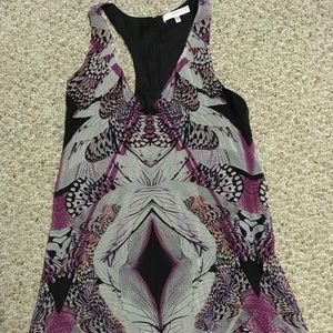 V-neck dress flowing just above knees